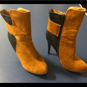 Tan suede boots with high heels and side zippers